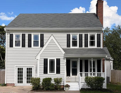Exterior with Spacious Driveway, room for 3 cars and street side parking. Driveway has basketball goal already in place for kids