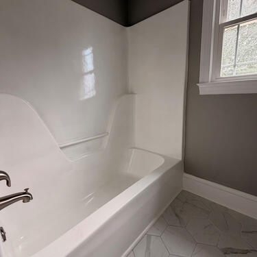 Remodeled 2nd bathroom with tub/shower, tile floor, new vanity